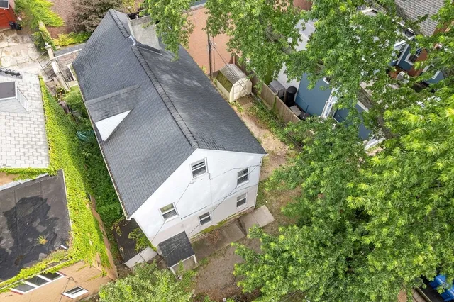 an aerial view of a house with outdoor space