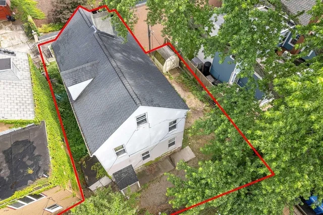 an aerial view of a house with outdoor space