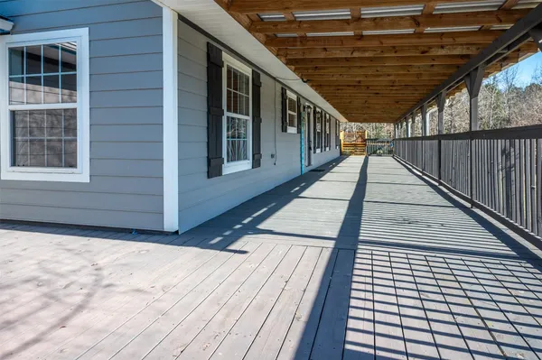 a balcony with wooden floor