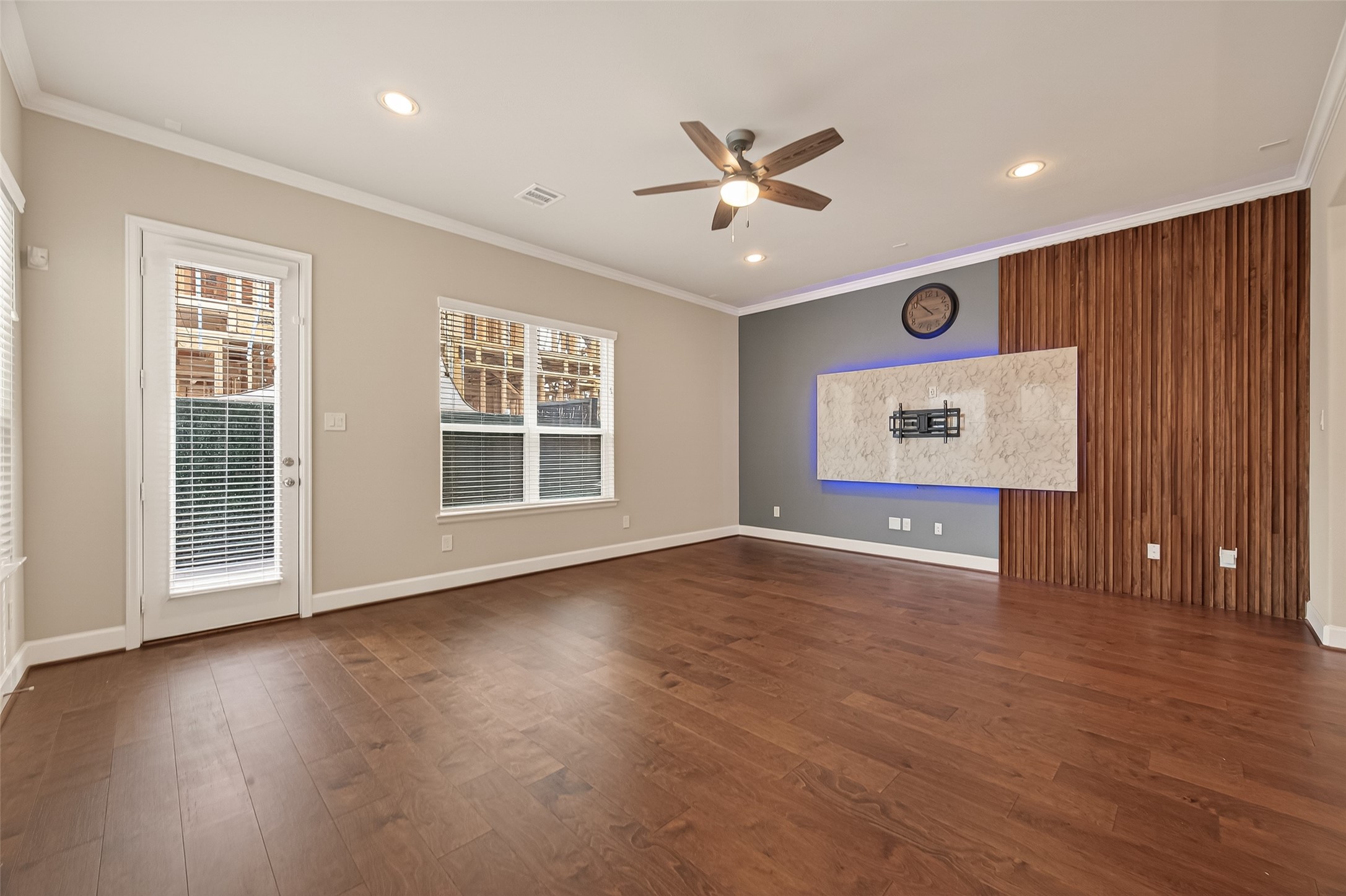 4413 Schuler Street, Unit B Houston, TX 77007 - Photo 12 of 46 a view of an empty room with wooden floor and a window