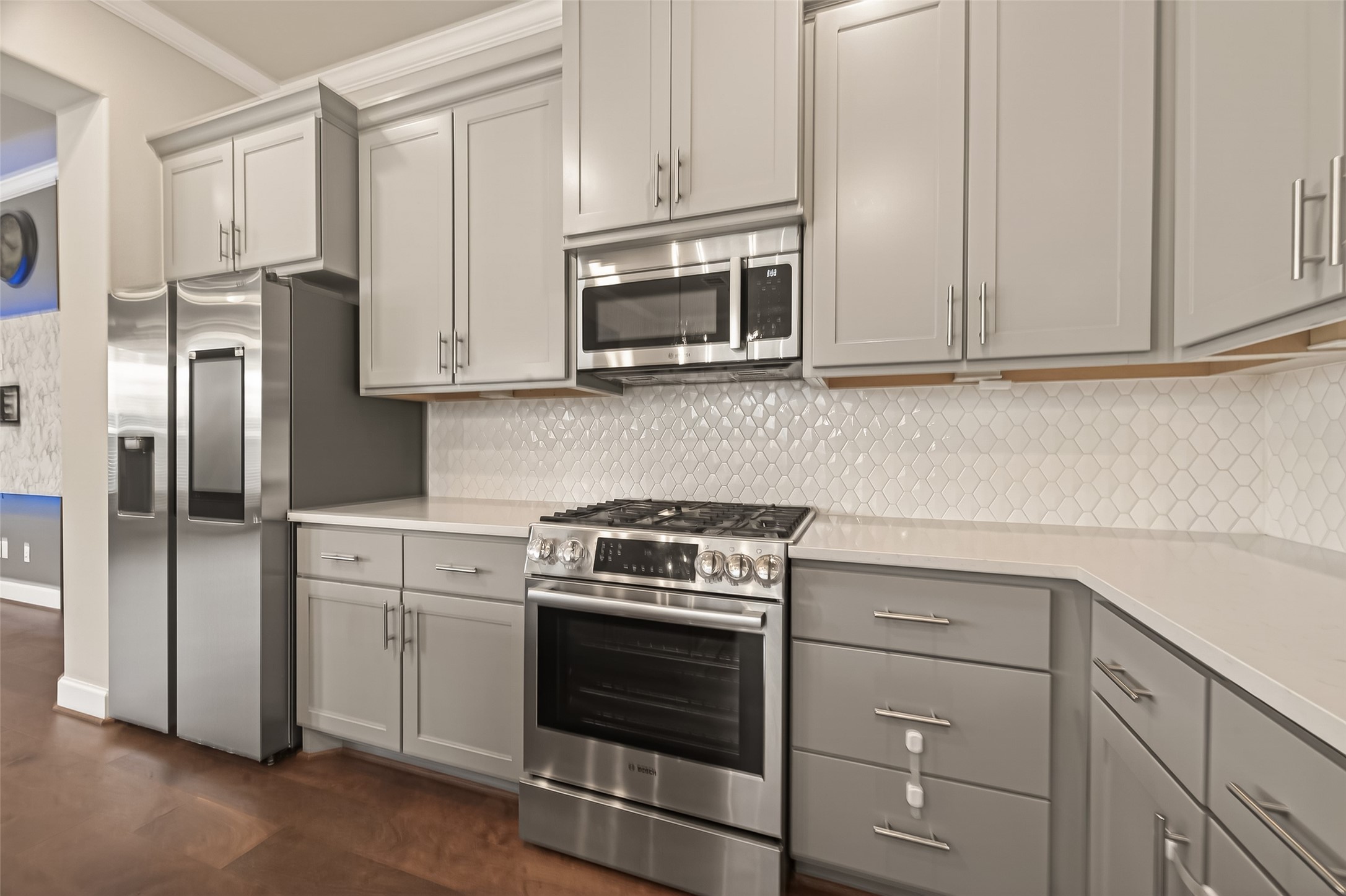 4413 Schuler Street, Unit B Houston, TX 77007 - Photo 18 of 46 a kitchen with cabinets stainless steel appliances and a sink