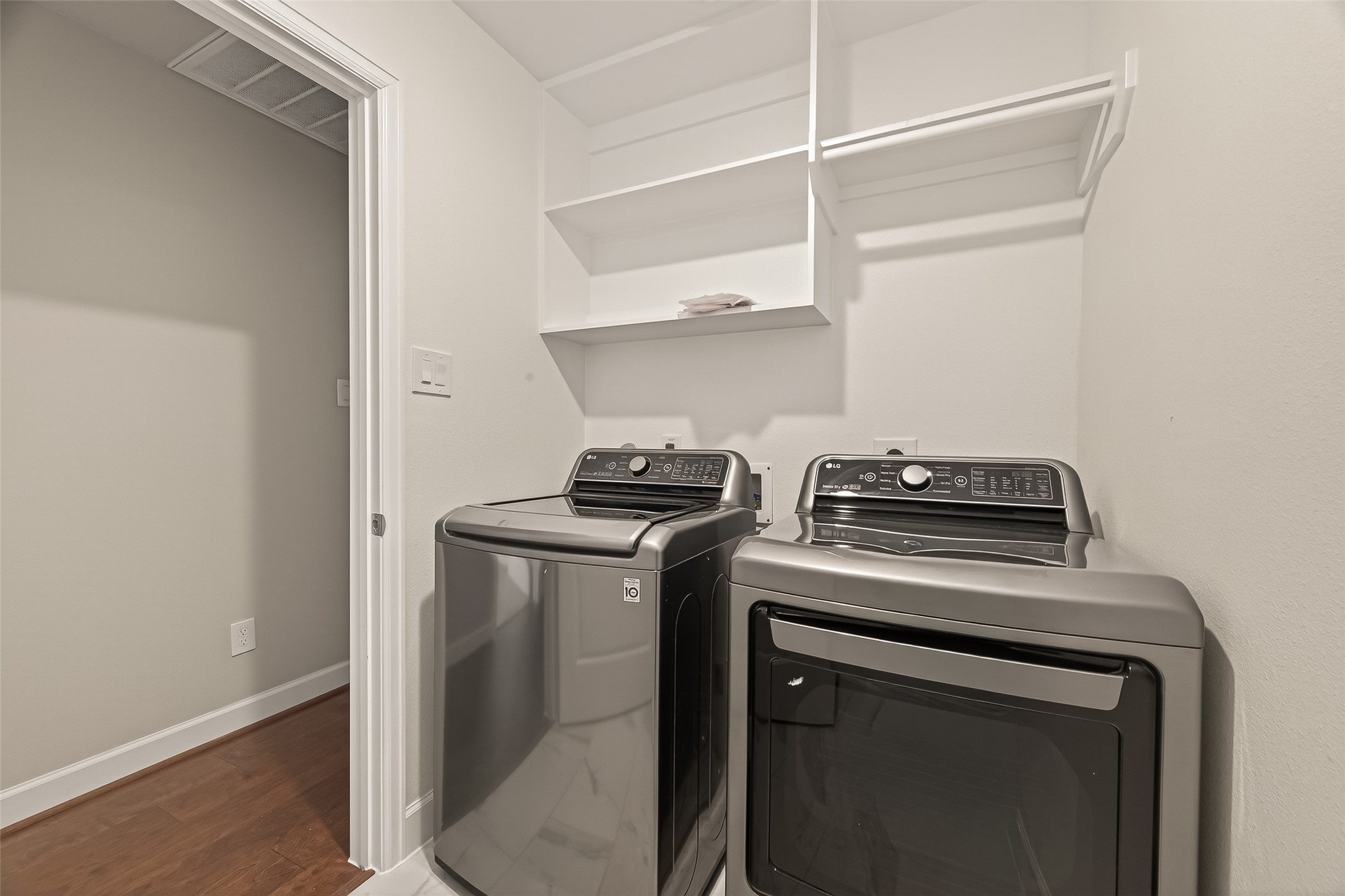 4413 Schuler Street, Unit B Houston, TX 77007 - Photo 21 of 46 a view of a kitchen with washer and dryer