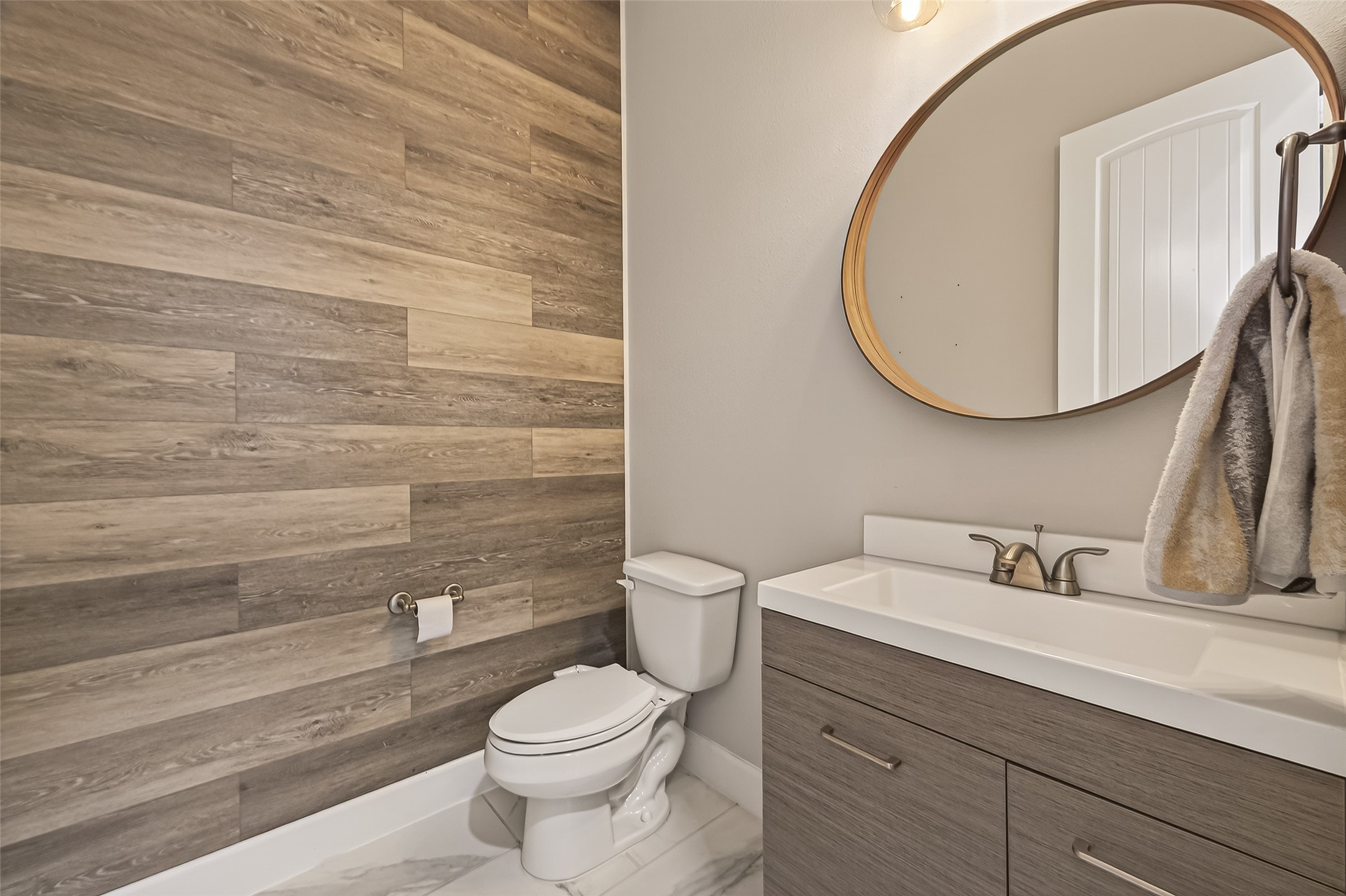 4413 Schuler Street, Unit B Houston, TX 77007 - Photo 22 of 46 a bathroom with a sink a toilet and a mirror