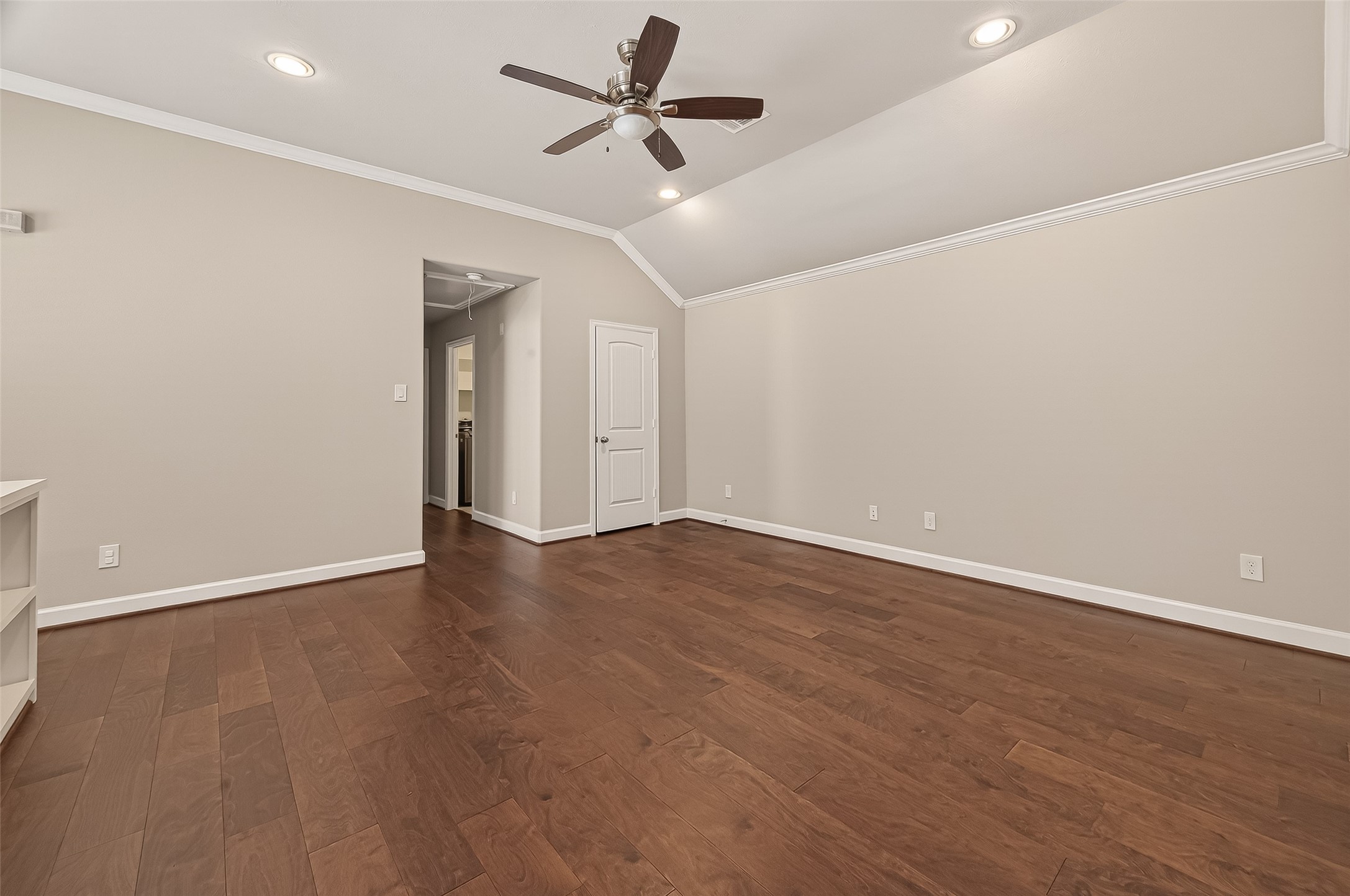 4413 Schuler Street, Unit B Houston, TX 77007 - Photo 24 of 46 an empty room with wooden floor ceiling fan and windows