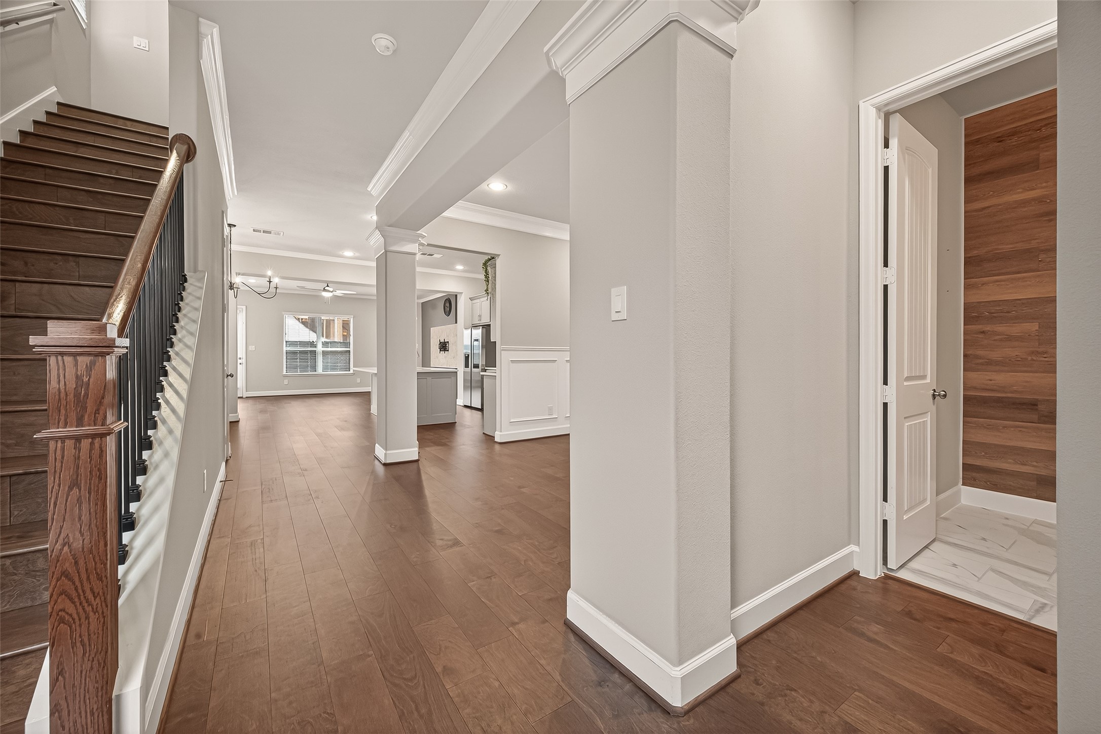 4413 Schuler Street, Unit B Houston, TX 77007 - Photo 7 of 46 a view of a hallway with wooden floor and staircase