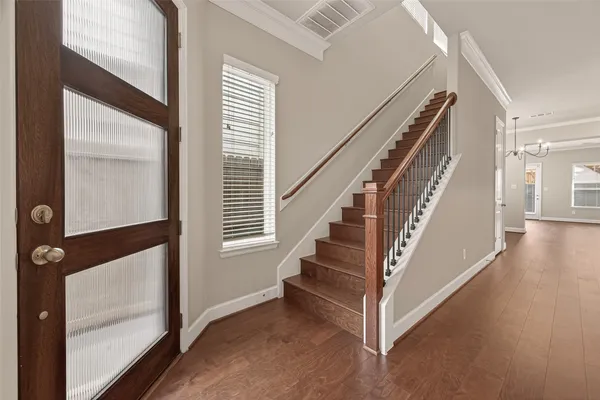 a large kitchen with kitchen island a sink stainless steel appliances and cabinets
