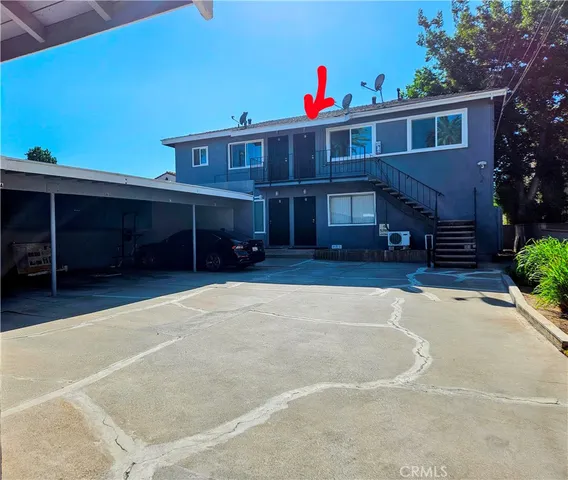 a view of a house with a yard and garage
