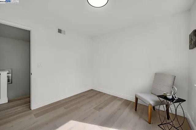 a view of a workspace with wooden floor