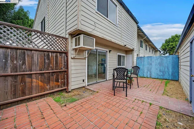 a view of an empty room with white walls