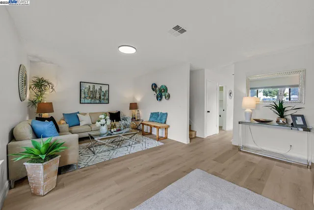 a living room with furniture and a couch