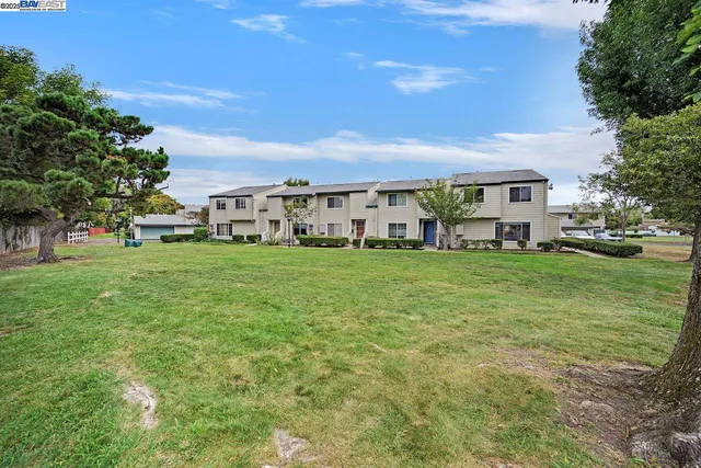 a view of a street with a sign board