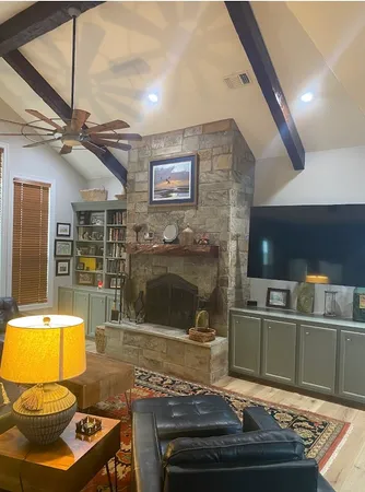 a view of a dining room with furniture chandelier and a chandelier