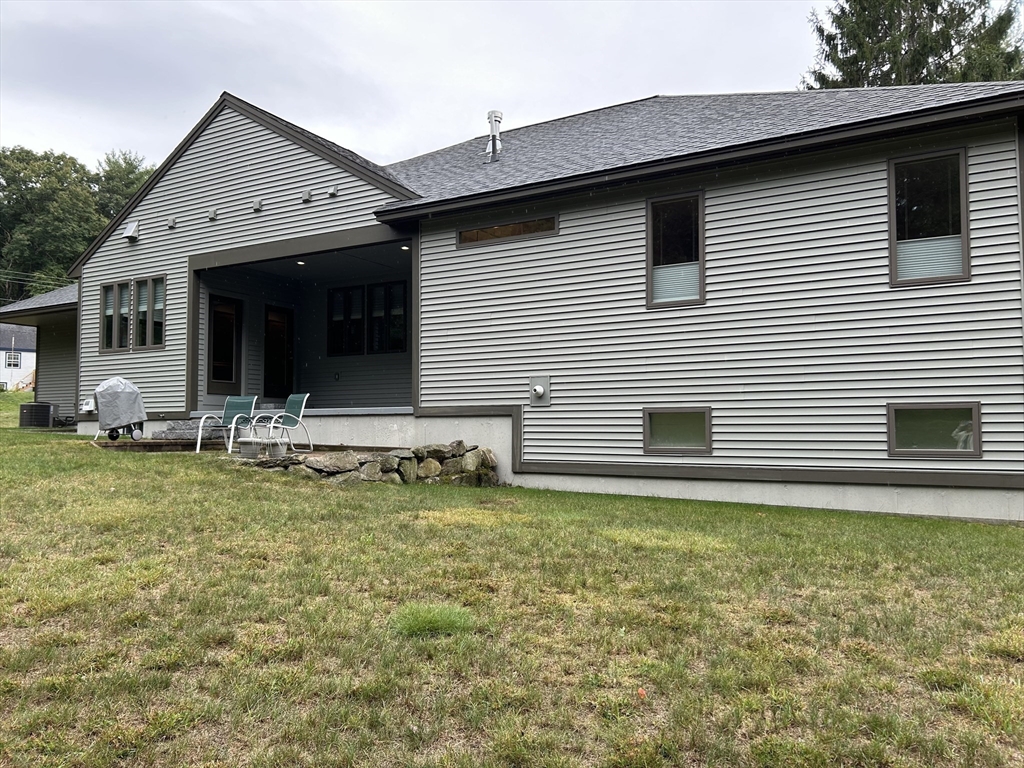 36 Nichols Road Peterborough, NH 03458 - Photo 4 of 41 a view of a house with backyard and chairs