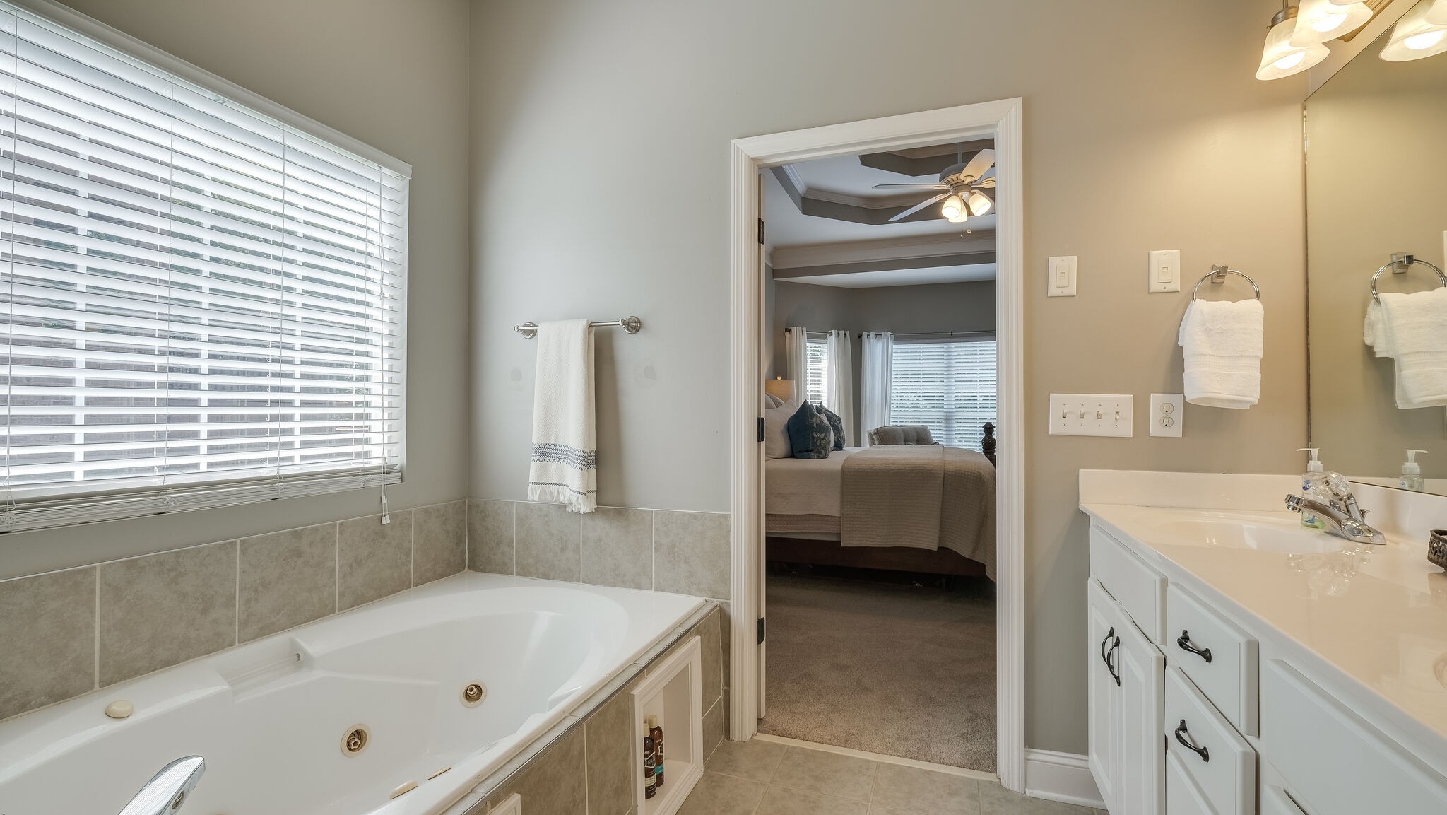 7005 Red Apple Road Antioch, TN 37013 - Photo 16 of 25 a en suite spacious bathroom with a tub sink and mirror
