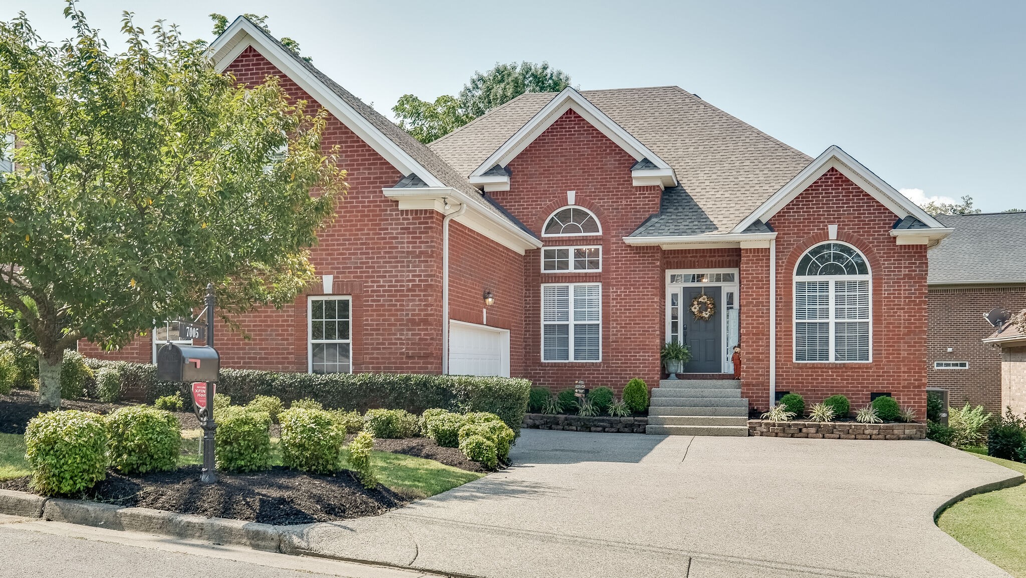 7005 Red Apple Road Antioch, TN 37013 - Photo 2 of 25 a front view of a house with a yard