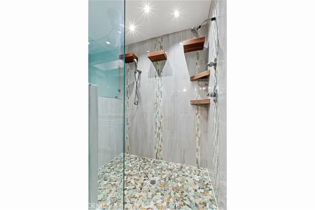 a picture of a bathroom with a shower