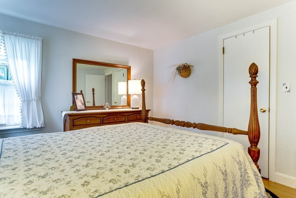 11 Newton Road Springfield, MA 01118 - Photo 24 of 30 a bedroom with a bed and a dresser