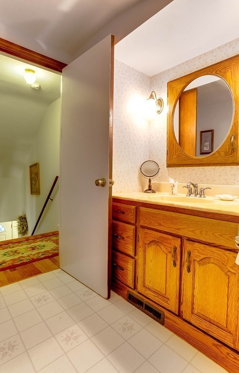 11 Newton Road Springfield, MA 01118 - Photo 25 of 30 a bathroom with a sink and a mirror