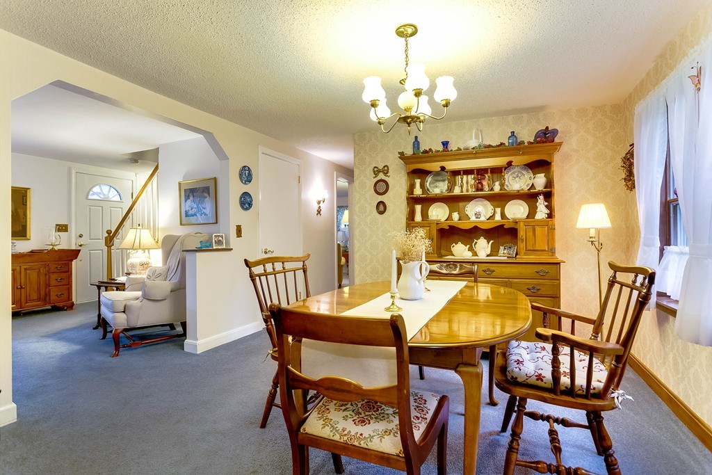 11 Newton Road Springfield, MA 01118 - Photo 5 of 30 a view of a dining room with furniture and chandelier