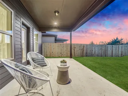 a view of a patio in backyard