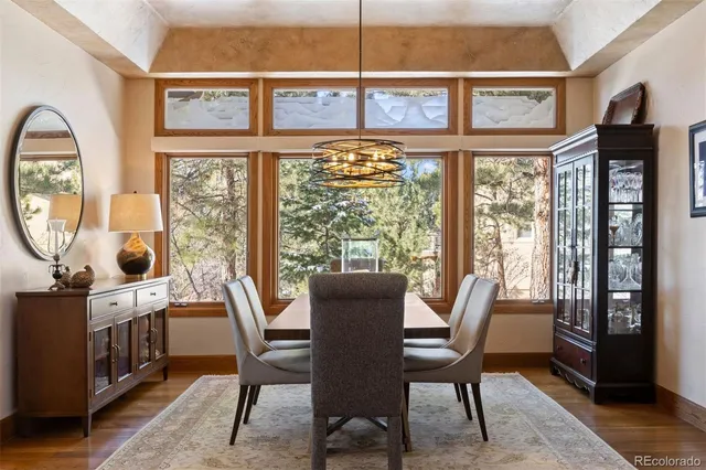 a view of a dining room with furniture window and wooden floor