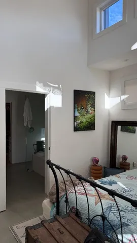 a bedroom with furniture and a bed