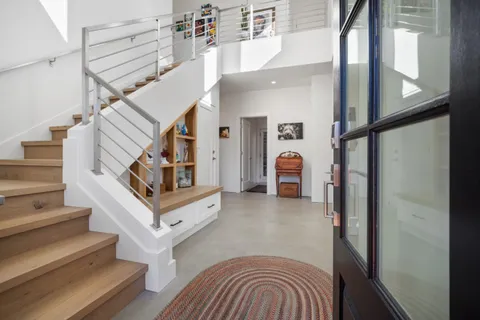 a stove top oven sitting inside of a kitchen