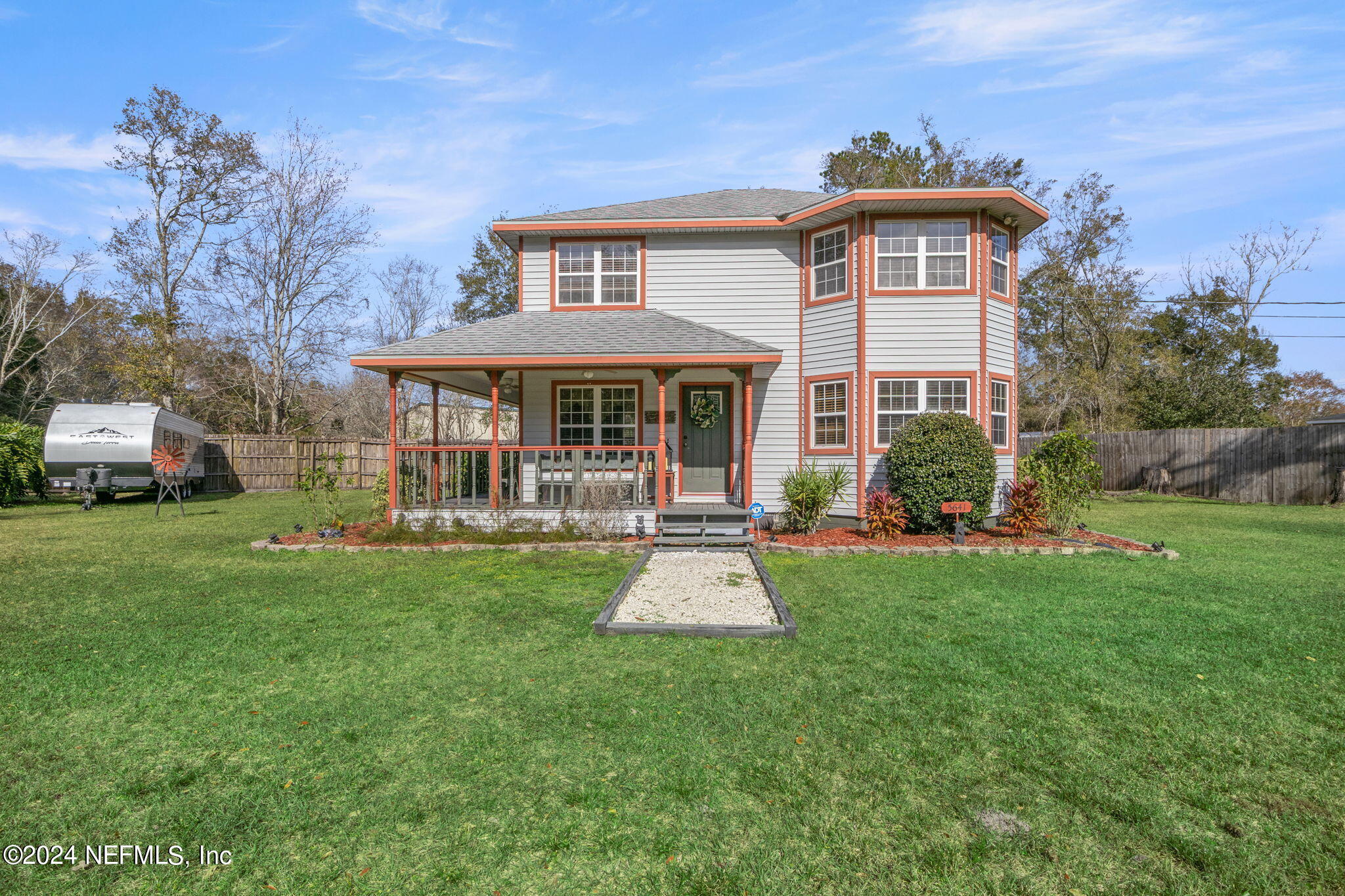 5641 Ricker Road Jacksonville, FL 32244 - Photo 2 of 33 a front view of a house with a yard