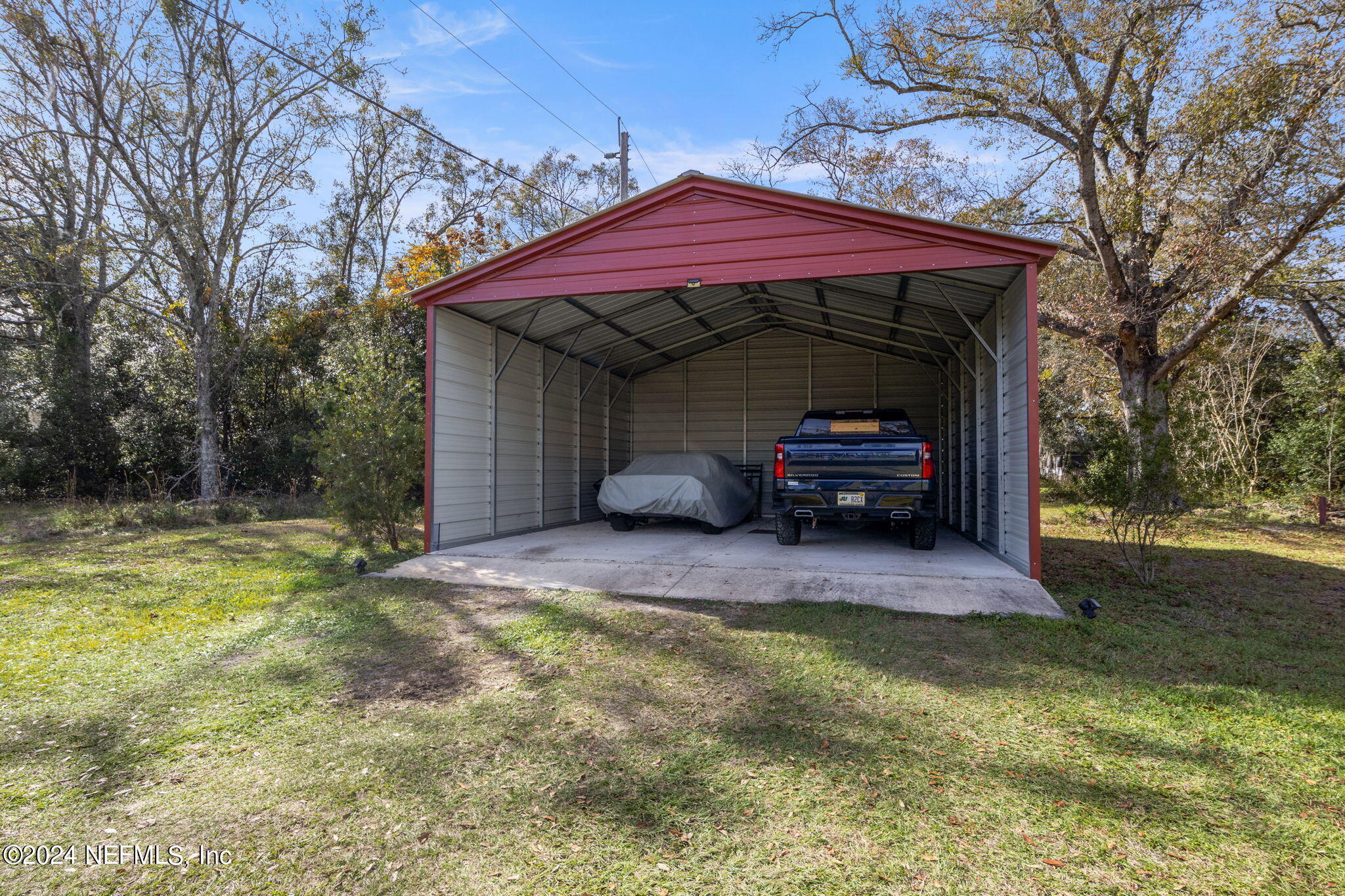 5641 Ricker Road Jacksonville, FL 32244 - Photo 28 of 33 a front view of house with yard and seating area