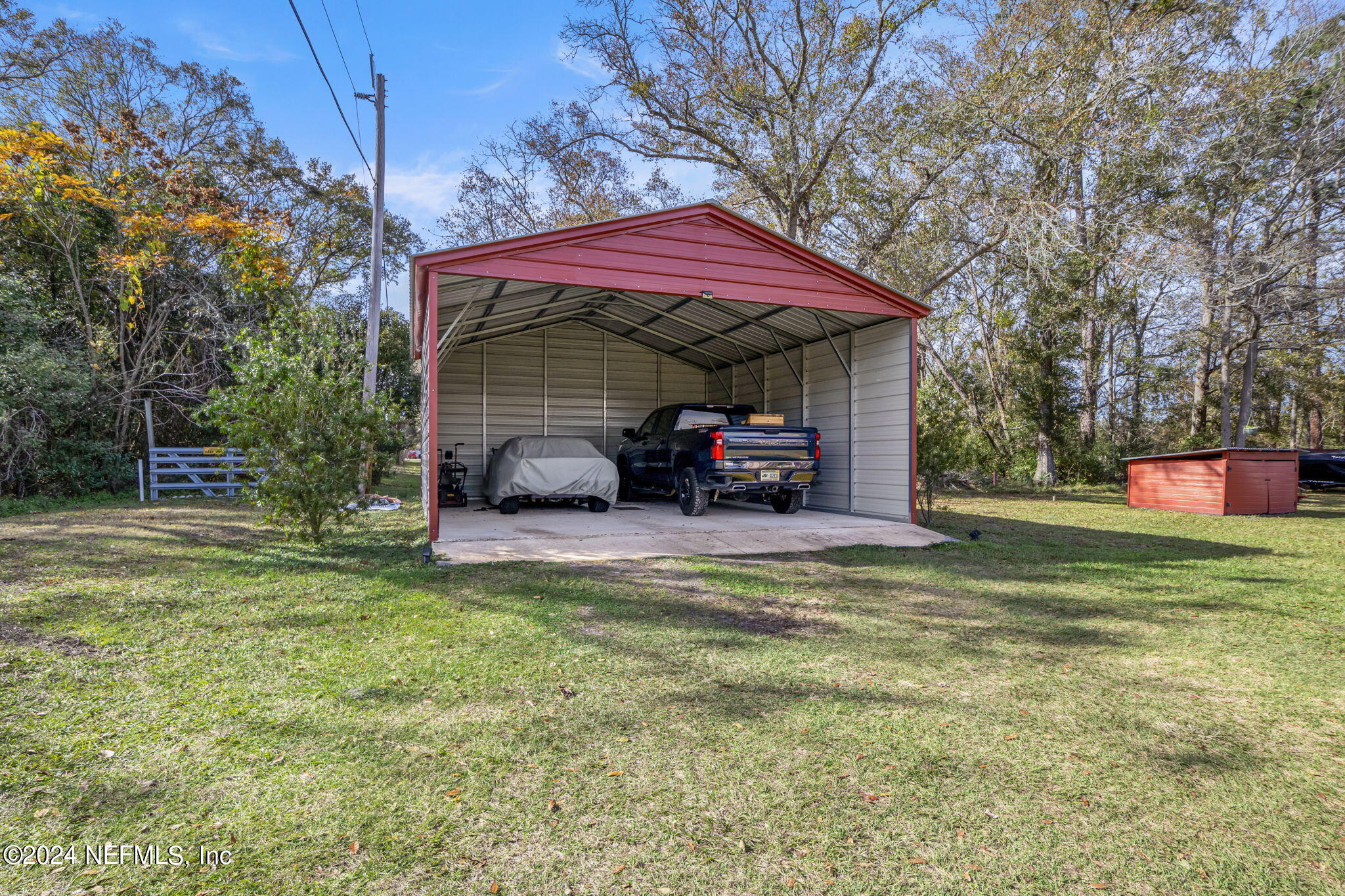5641 Ricker Road Jacksonville, FL 32244 - Photo 29 of 33 a view of a house with a yard
