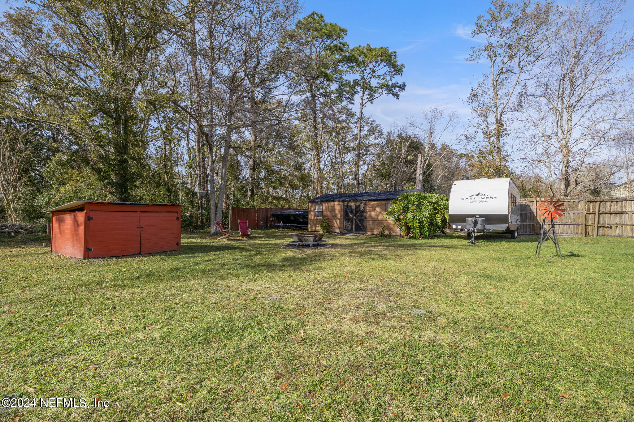 5641 Ricker Road Jacksonville, FL 32244 - Photo 31 of 33 a front view of a house with a garden and tree