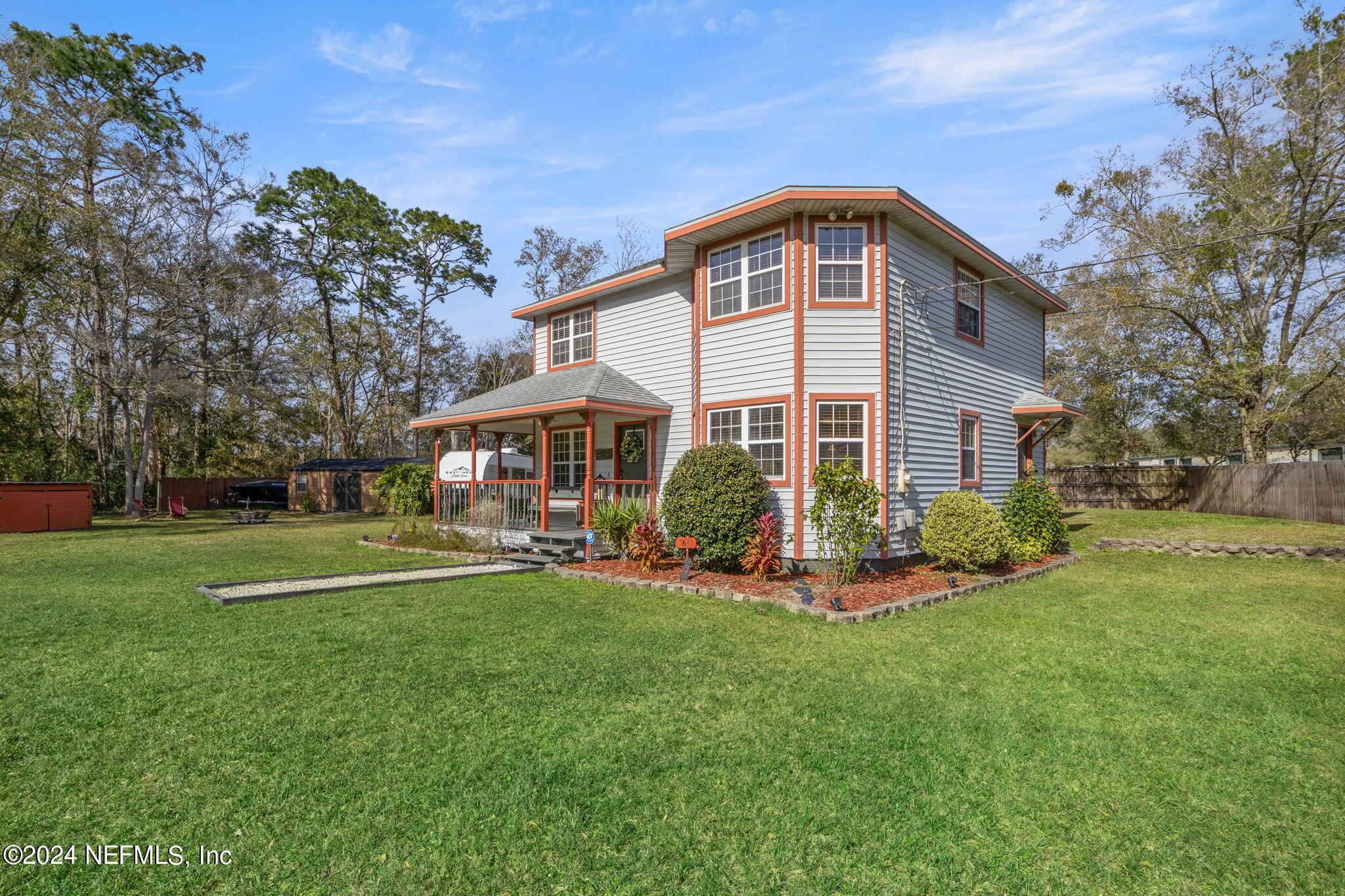 5641 Ricker Road Jacksonville, FL 32244 - Photo 4 of 33 a front view of a house with a yard