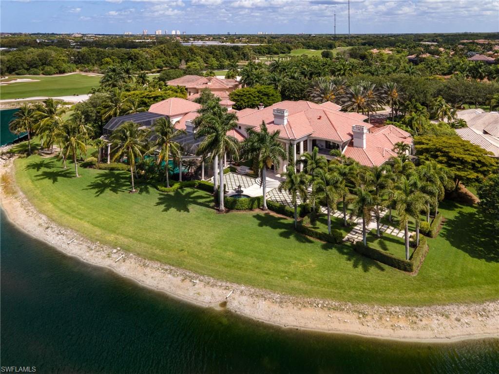 14928 Celle Way Naples, FL 34110 - Photo 14 of 35 a aerial view of a house with a garden and lake view