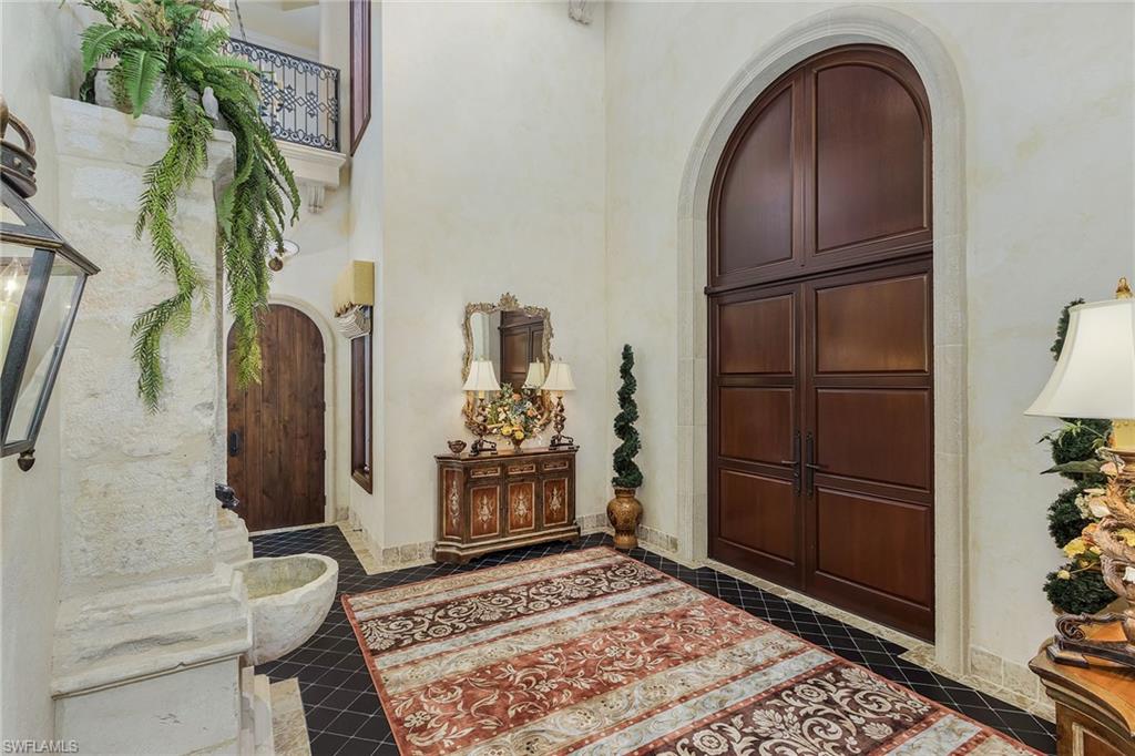 14928 Celle Way Naples, FL 34110 - Photo 17 of 35 a view of front door with a potted plant