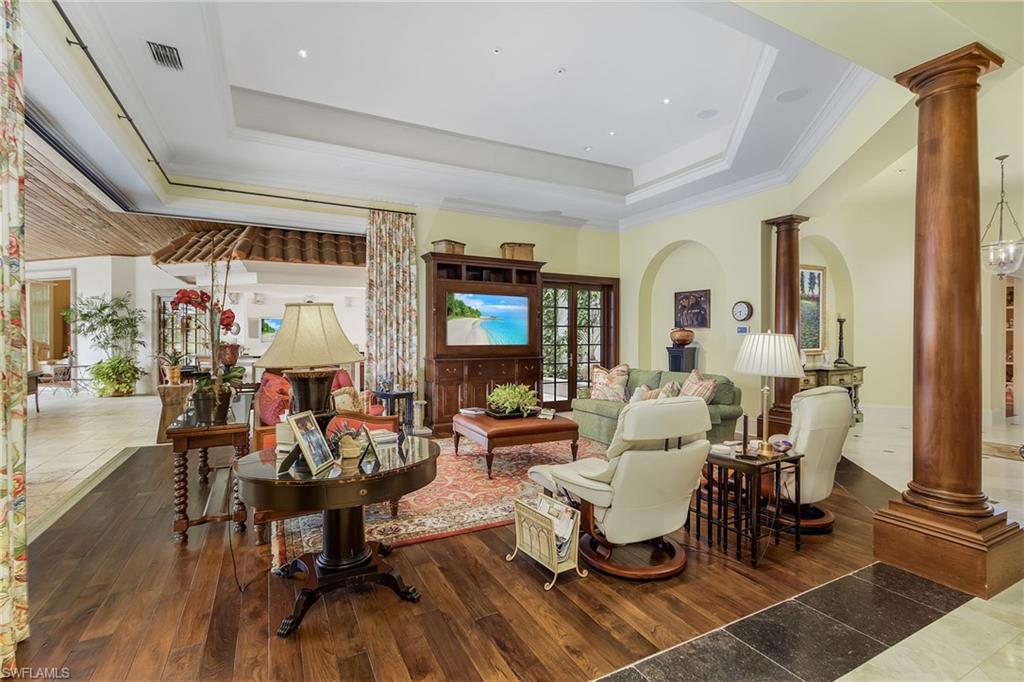 14928 Celle Way Naples, FL 34110 - Photo 23 of 35 a living room with furniture and a large window