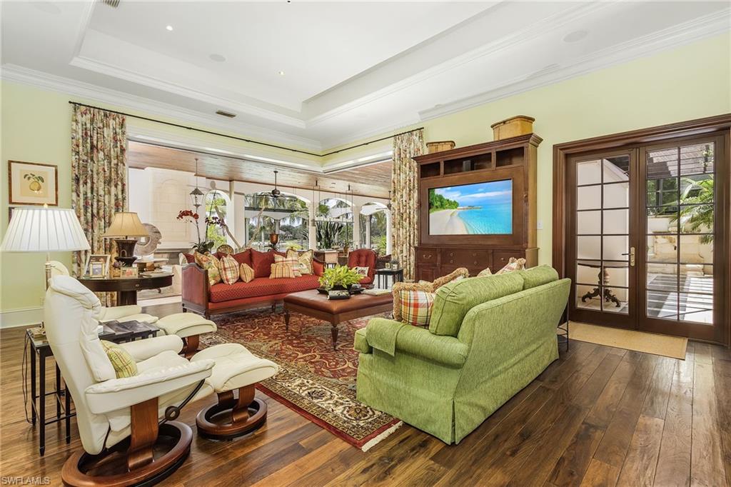 14928 Celle Way Naples, FL 34110 - Photo 24 of 35 a living room with furniture and a large window