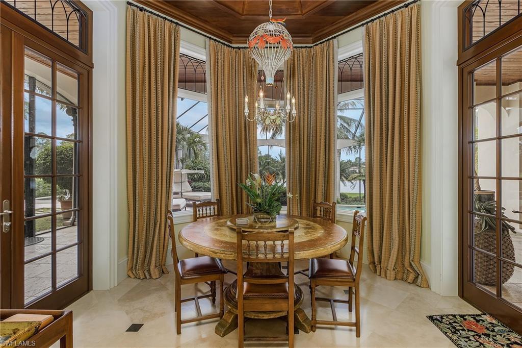 14928 Celle Way Naples, FL 34110 - Photo 25 of 35 a dining room with furniture and window