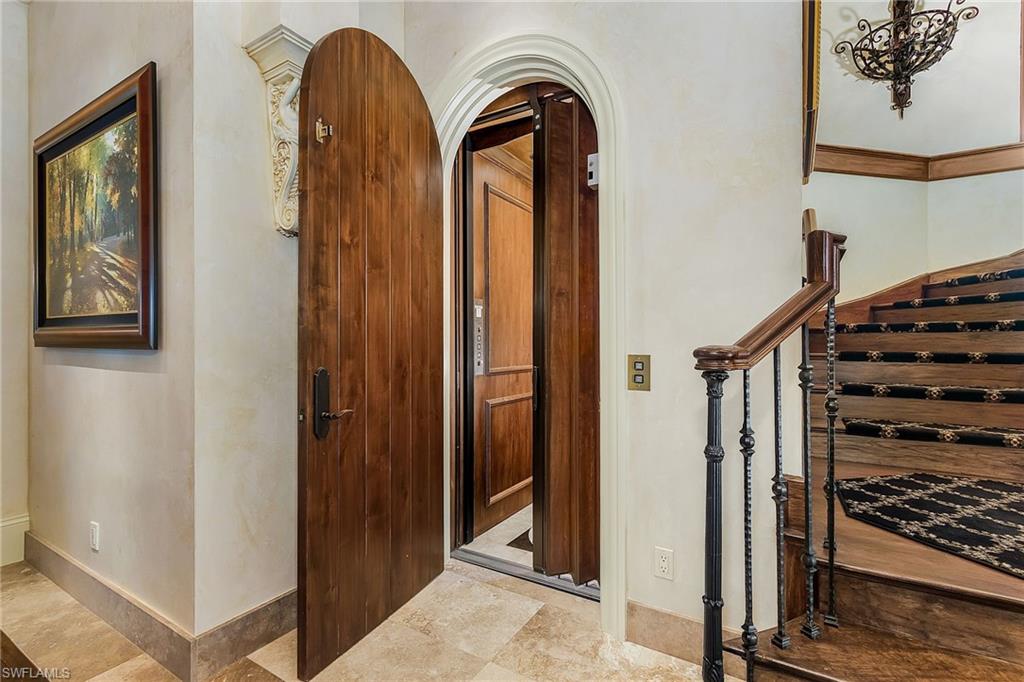 14928 Celle Way Naples, FL 34110 - Photo 31 of 35 a view of front door with wooden door