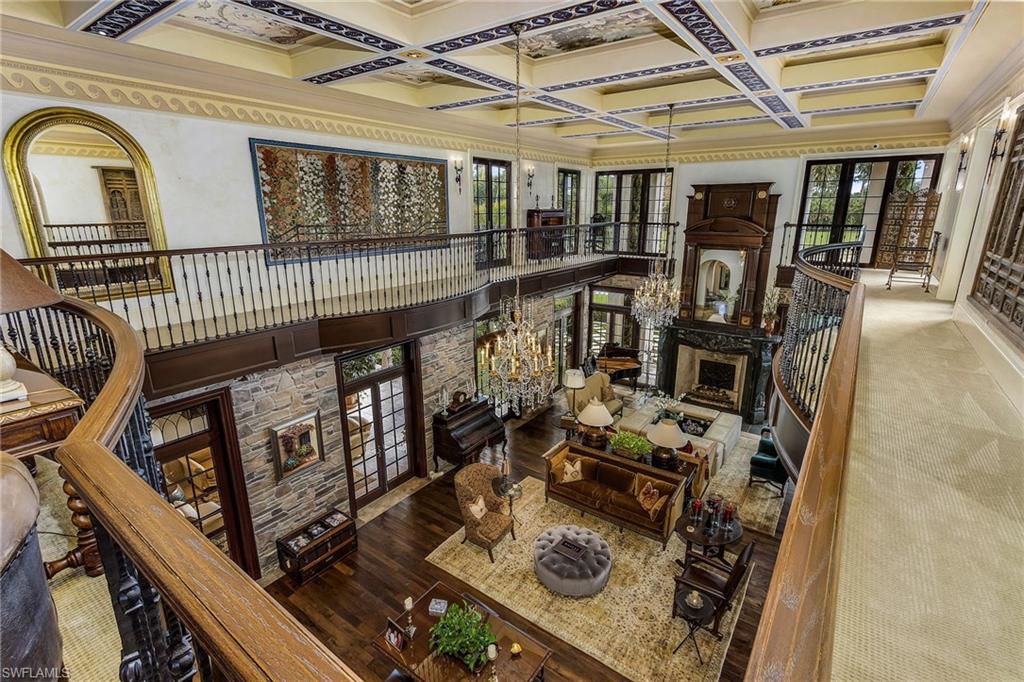 14928 Celle Way Naples, FL 34110 - Photo 33 of 35 a view of a balcony with chairs and wooden floor