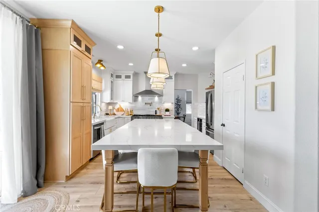a view of kitchen island with furniture and wooden floor