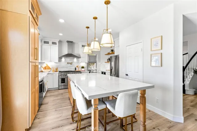 a view of kitchen with cabinets and wooden floor