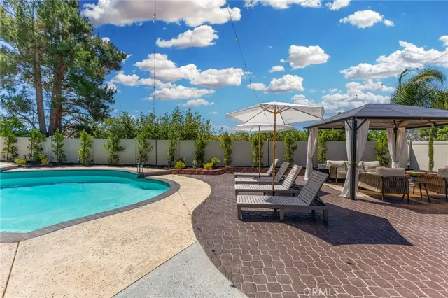 a view of a patio with swimming pool