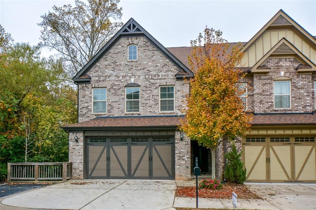 13335 Flamingo Road Milton, GA 30004 - Photo 1 of 1 a view of a brick house with large windows