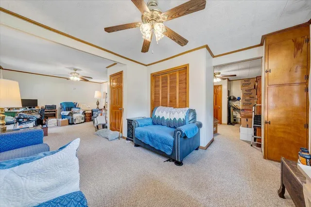 a living room with furniture and a chandelier