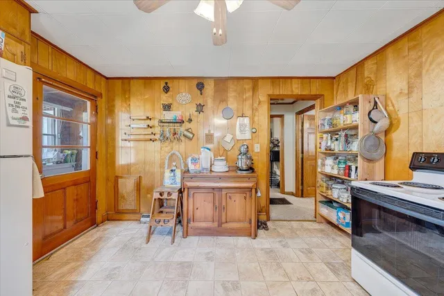a bedroom with bed and a window