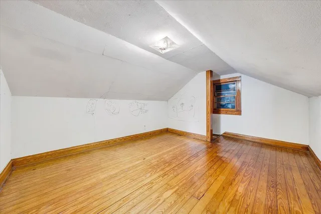 a view of hallway with wooden floor
