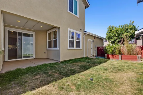 a view of front door of house with yard