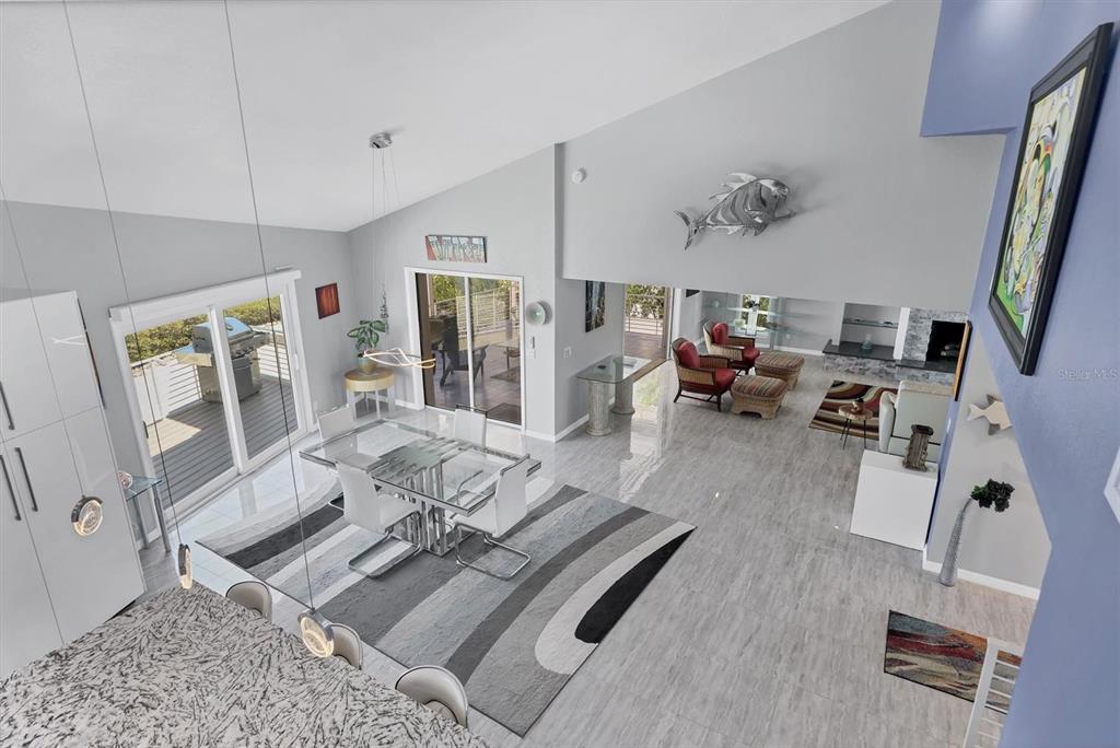 7985 Manasota Key Road Englewood, FL 34223 - Photo 25 of 83 a living room with furniture and a flat screen tv