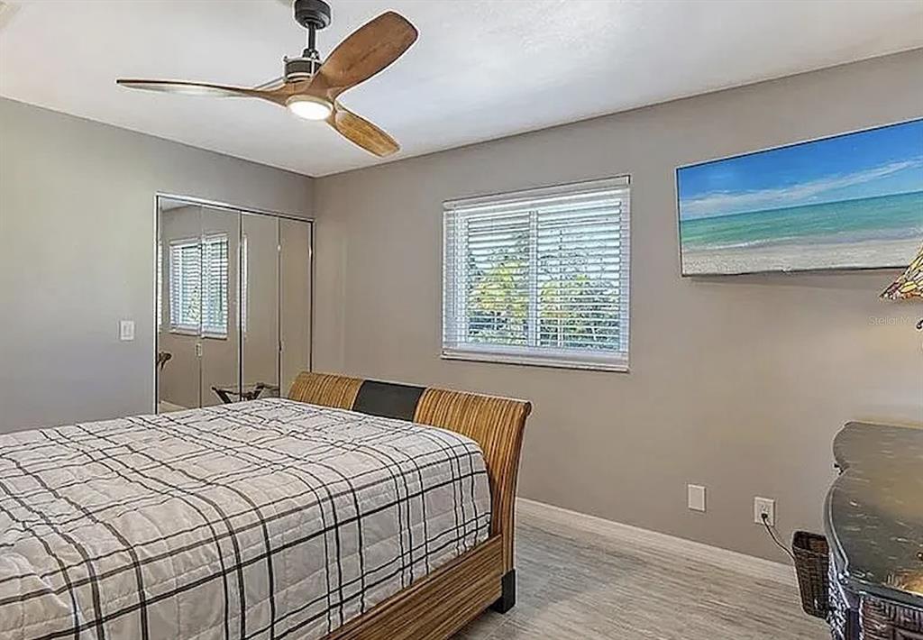 7985 Manasota Key Road Englewood, FL 34223 - Photo 33 of 83 a bedroom with a bed and a window