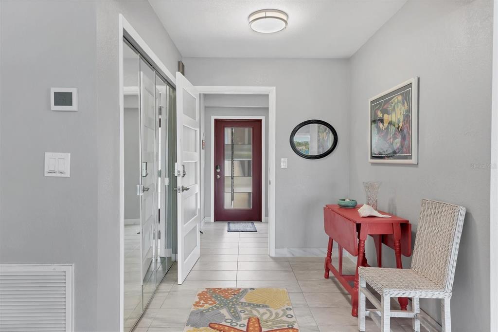 7985 Manasota Key Road Englewood, FL 34223 - Photo 40 of 83 a view of a room with furniture and wooden floor